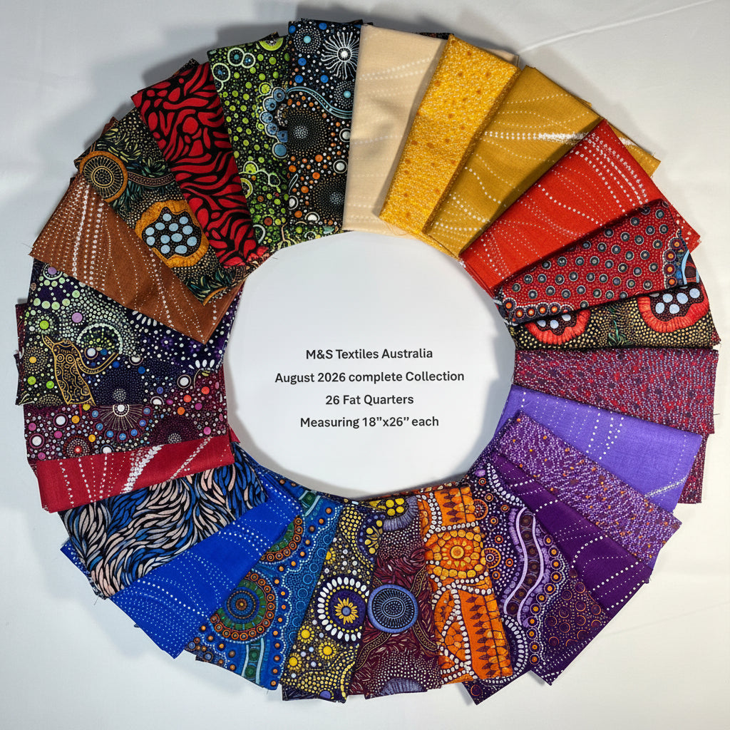 A circular arrangement of 26 folded fabric samples from M&S Textiles Australia's August 2026 complete collection, featuring Australian Aboriginal designs in a rainbow spectrum of colors