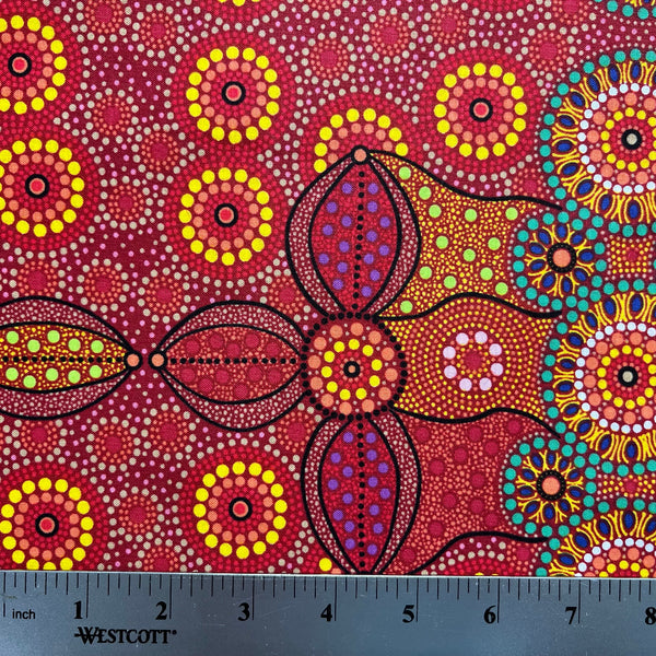 Campsite red is a striking design in vibrant shades of red, green and yellow with white circle accents by Aboriginal Artist Bernadine Wallace.