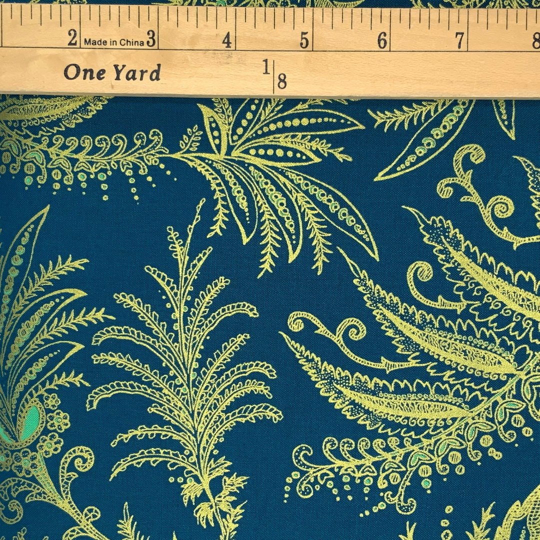 An exotic flower design in shades of teal and gold.