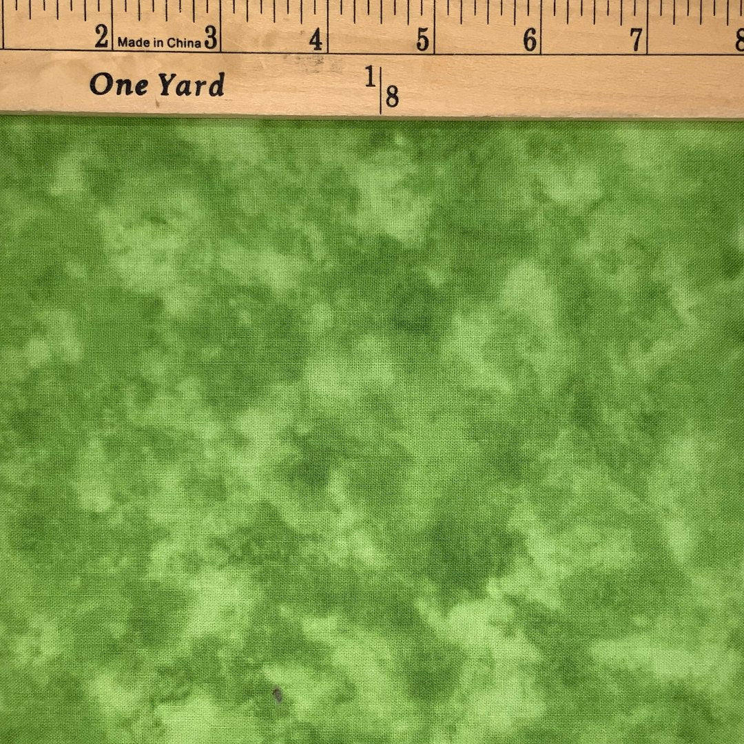 A screen print design in shades of green.