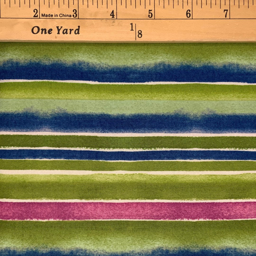 A stripe print design in of green, blue, pink and white.