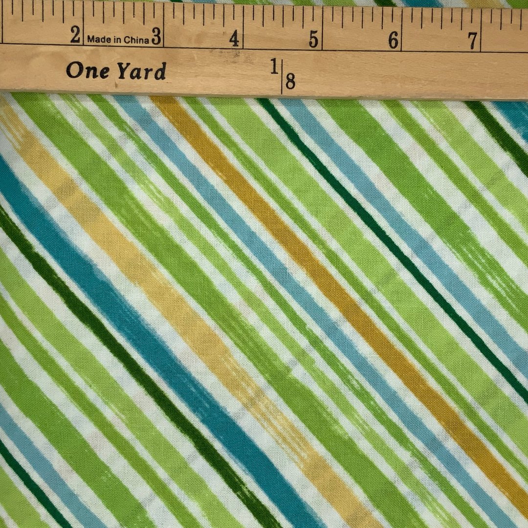 A striped design in shades of green, peach, blue and white .