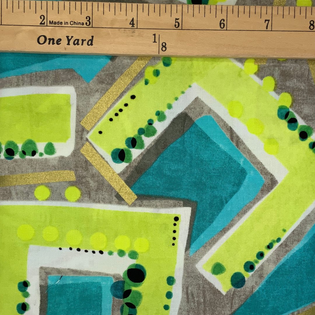 A modern geometric design in shades of green, black, brown, metallic gold and white .