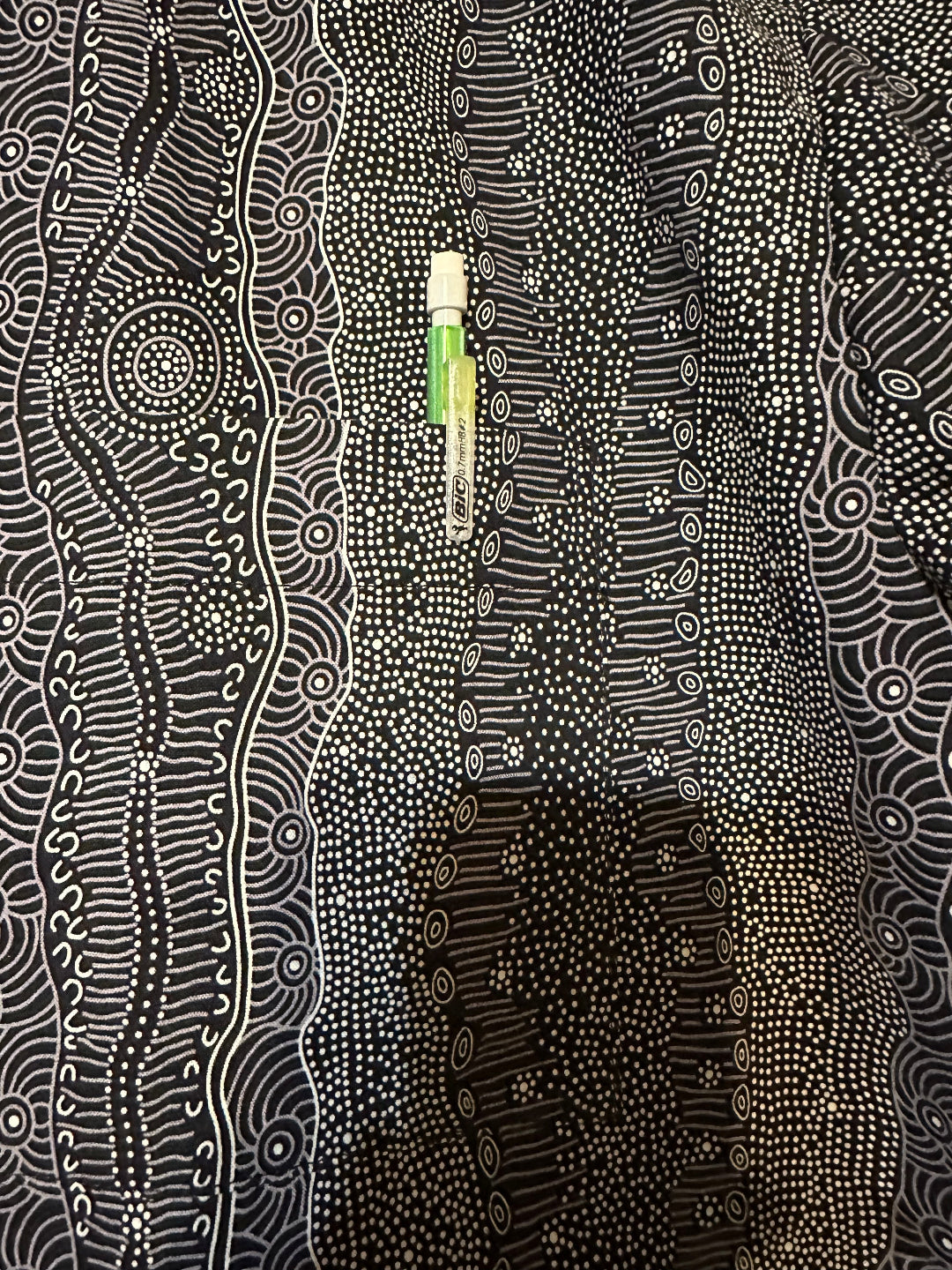 Closeup of perfectly matched black and white pocket detail on handmade men's shirt