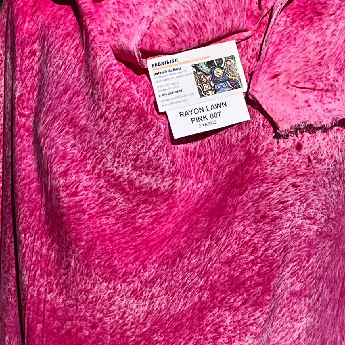 A SPLADDER DYED PINK PIECE OF FABRIC