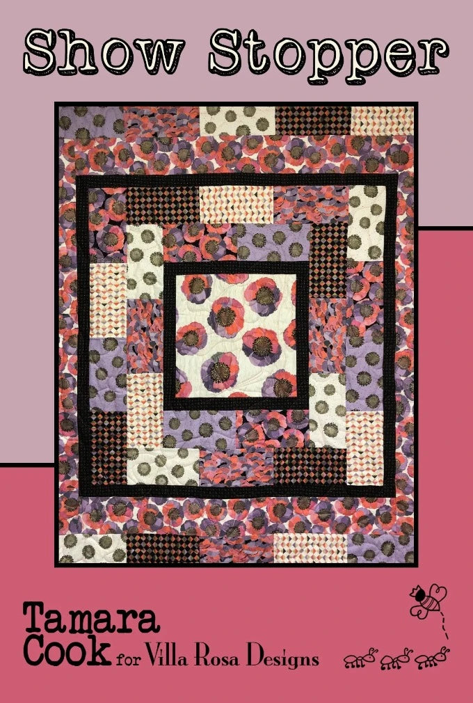 Show Stopper quilt pattern uses Fat Quarters to showcase one central design, surrounded by a band of support staff.