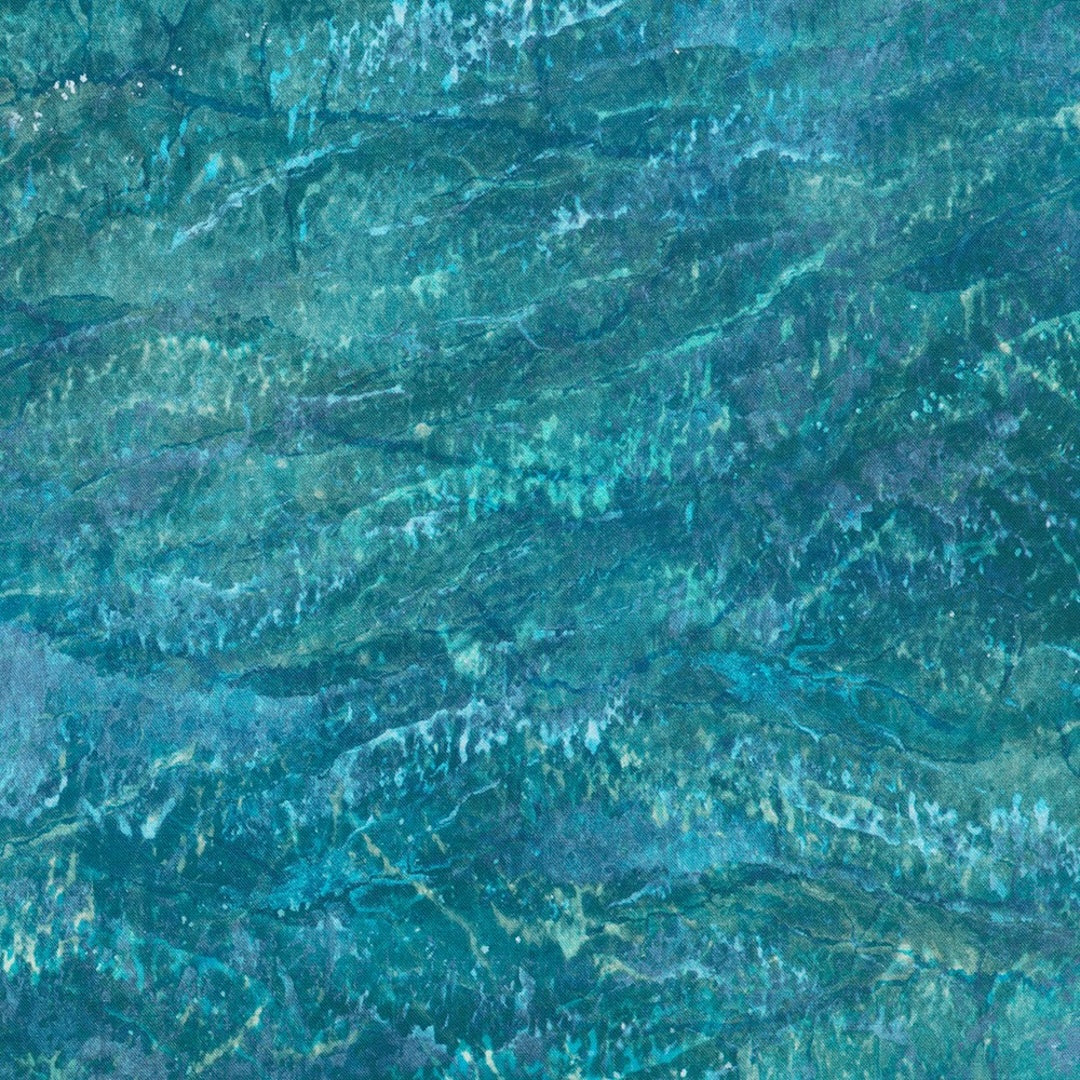 The gorgeous blend of teal, navy, dusty blue, and turquoise creates an enchanting color palette that'll make everyone ask where you found such magic.