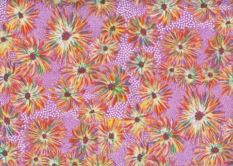 Aster-like flowers with orange, yellow and brown petals on a purple background