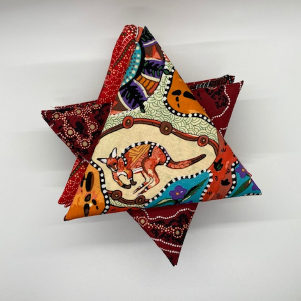 A curated collection of Australian Aboriginal fabrics featuring the color red in  10 different hues and tones.