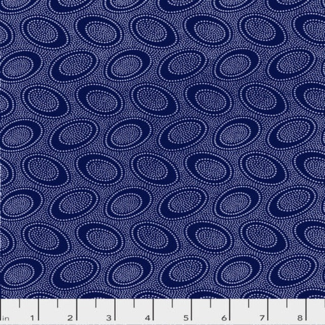 Tiny white dots arranged in ovals, on a rich purplish blue background, reminiscent of Australian aboriginal art.