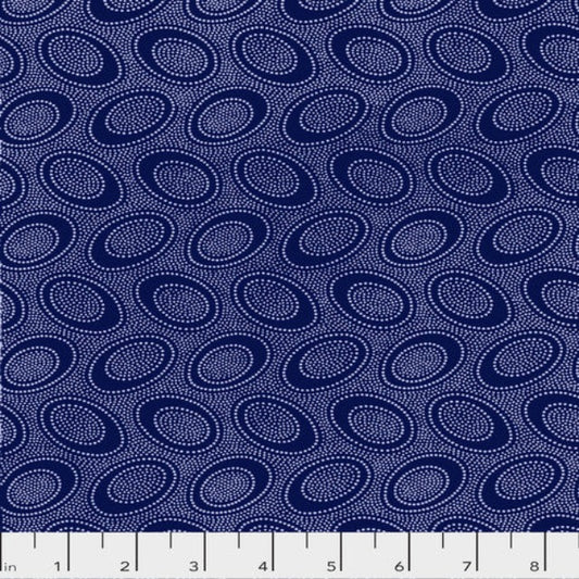 Tiny white dots arranged in ovals, on a rich purplish blue background, reminiscent of Australian aboriginal art.
