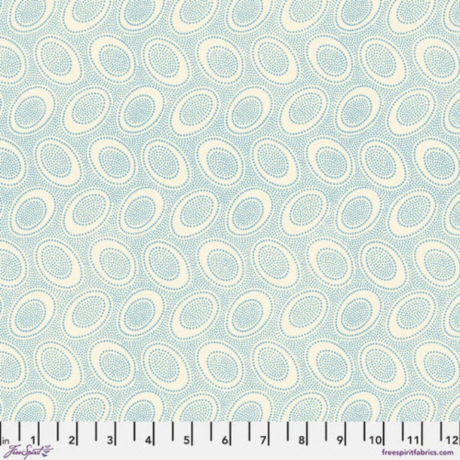 Tiny greyish blue dots arranged in ovals, on a cream colored background, reminiscent of Australian aboriginal art.