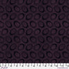 Tiny pinkish purple dots arranged in ovals, on a black background, reminiscent of Australian aboriginal art. 