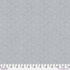 Tiny white dots arranged in ovals, on a taupish greybackground, reminiscent of Australian aboriginal art.
