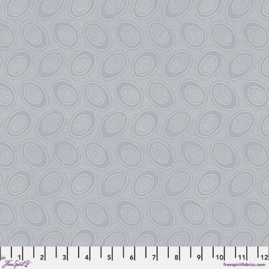 Tiny white dots arranged in ovals, on a taupish greybackground, reminiscent of Australian aboriginal art.