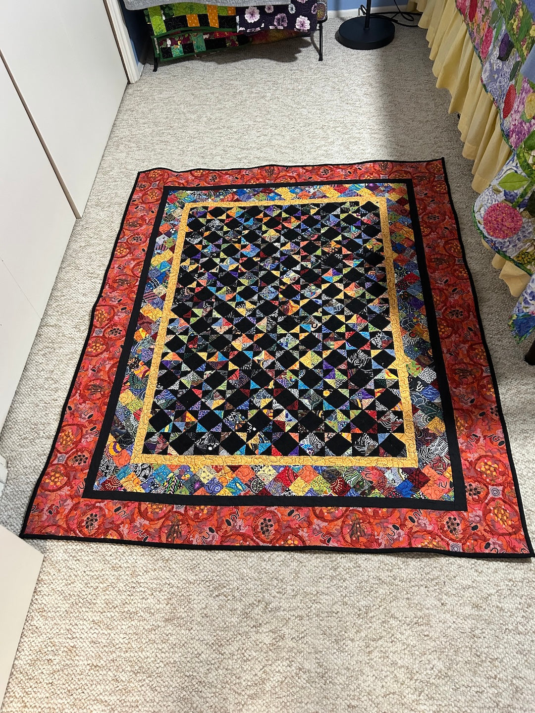 A colorful Scrap Quilt made from 600 Half Square triangles