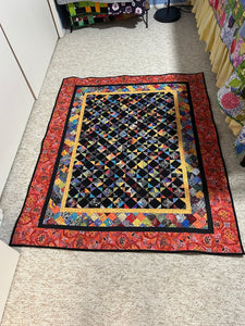 A colorful Scrap Quilt made from 600 Half Square triangles
