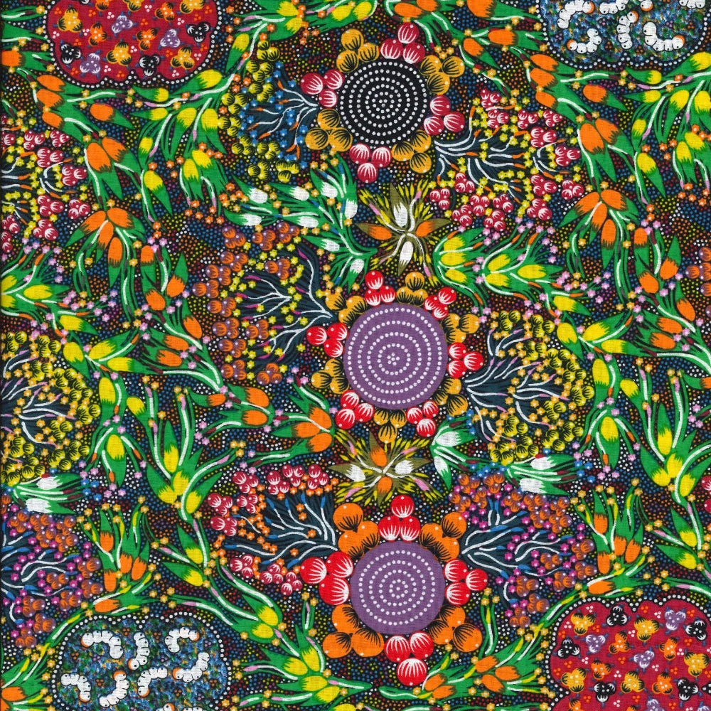 Bush Plum &amp; Bush Banana multi by Marilyn Abbot features indigenous designs of flowers and foods in oranges, reds and vibrant greens against a black backdrop.