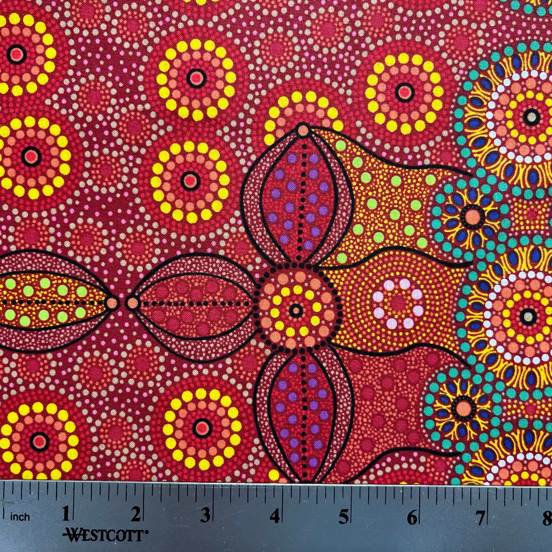 Campsite red is a striking design in vibrant shades of red, green and yellow with white circle accents by Aboriginal Artist Bernadine Wallace.