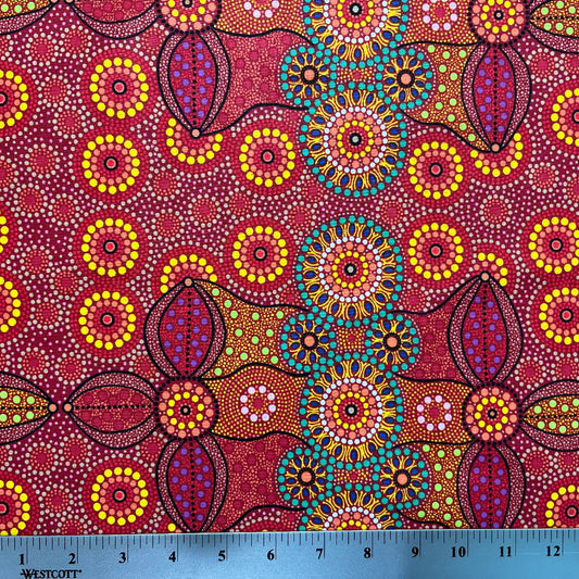 Campsite red is a striking design in vibrant shades of red, green and yellow with white circle accents by Aboriginal Artist Bernadine Wallace.