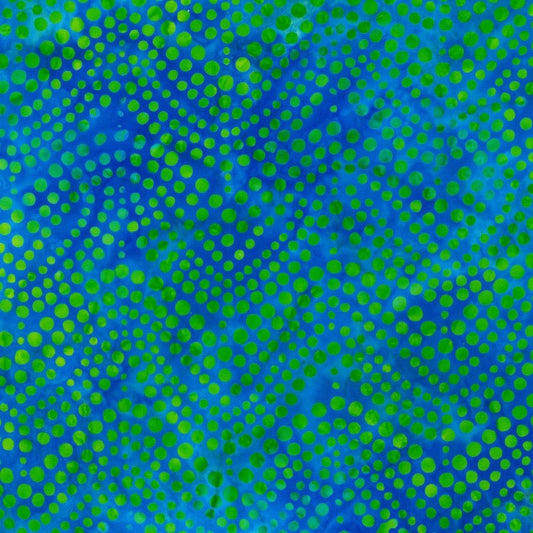 Dottie - Pond is a wavy design in blueberry-sized green bubbles on a blue background, stretching from selvedge to selvedge. 