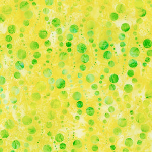 Dottie - Pineapple is a bubbly design in lime green on a juicy pineapple yellow background, featuring rising bubbles in a wavy pattern. 