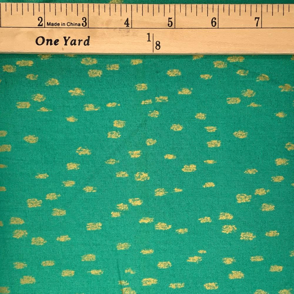 A gorgeous green fabric with little golden specks