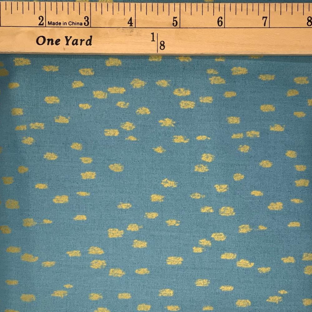 A gorgeous dusty sky blue fabric with little golden specks