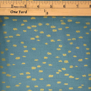 A gorgeous dusty sky blue fabric with little golden specks