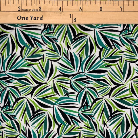 A leaf design in shades of green, black and white.