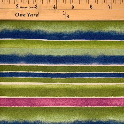 A stripe print design&nbsp; in of green, blue, pink and white.