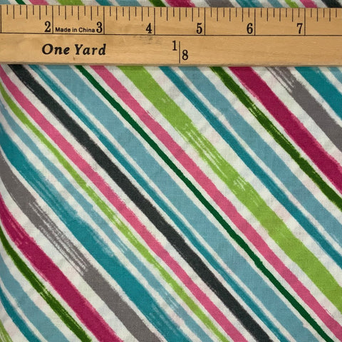 A striped design&nbsp; in shades of blue, green, pink, brown, beige&nbsp; and white .