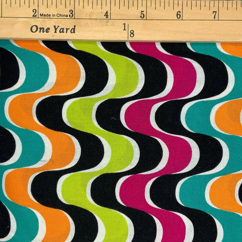 A wave design in shades of black, orange, teal, pink&nbsp; and white.