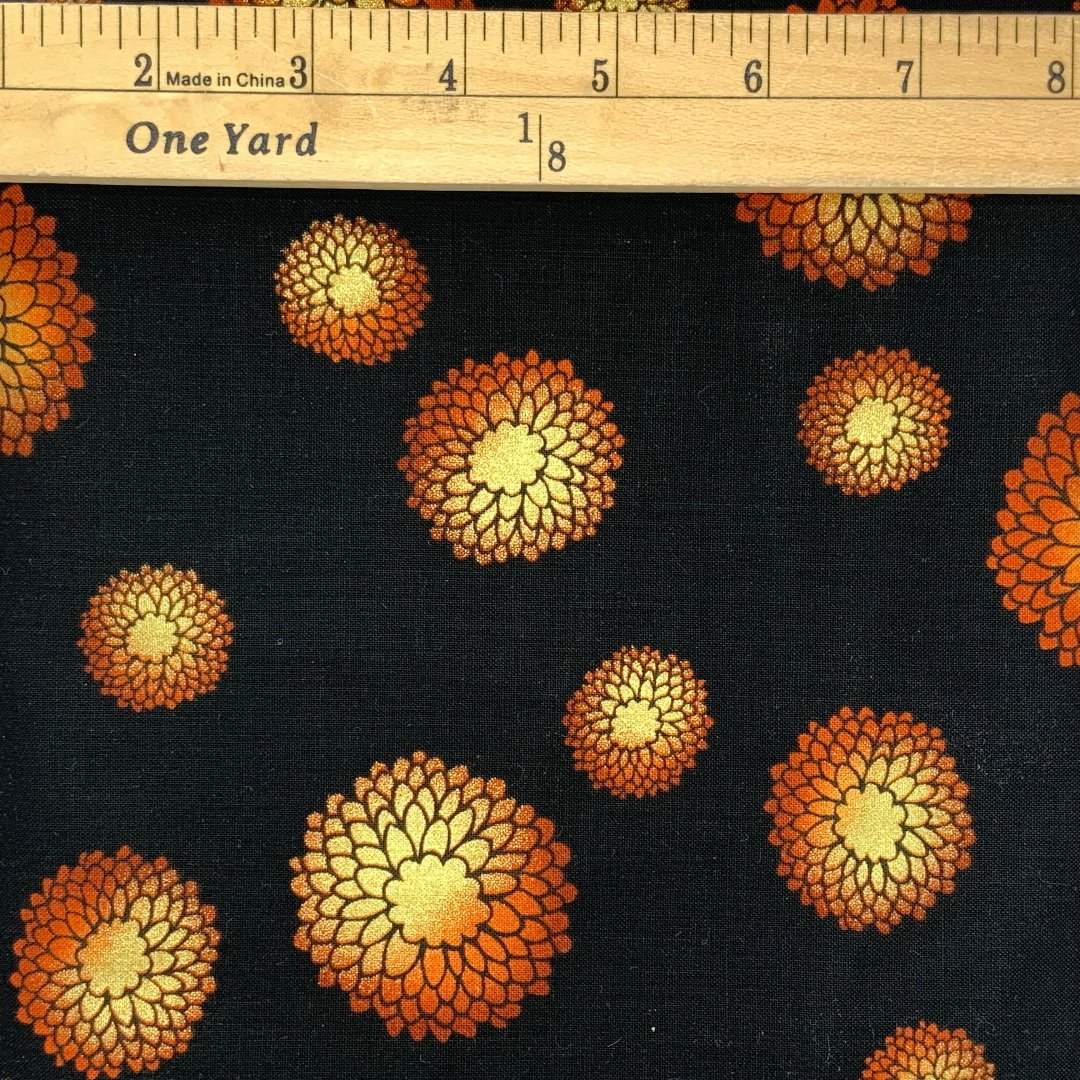 A flower design in black, burnt orange and gold. Some fabrics do not photograph as they actually look.