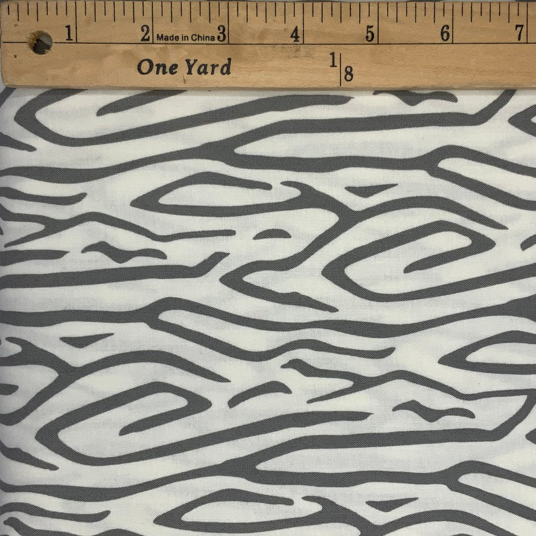 A modern line design in shades of gray and white.