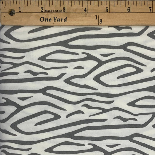 A modern line design in shades of gray and white.