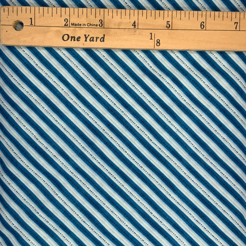 A striped design in shades of blue and white.