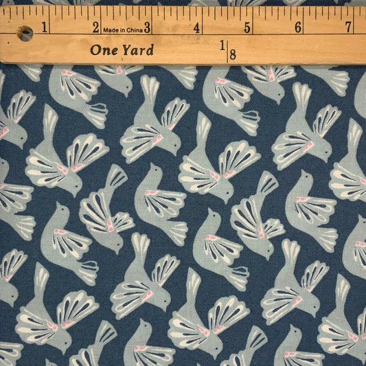 A bird design in shades of blue, white and pink.