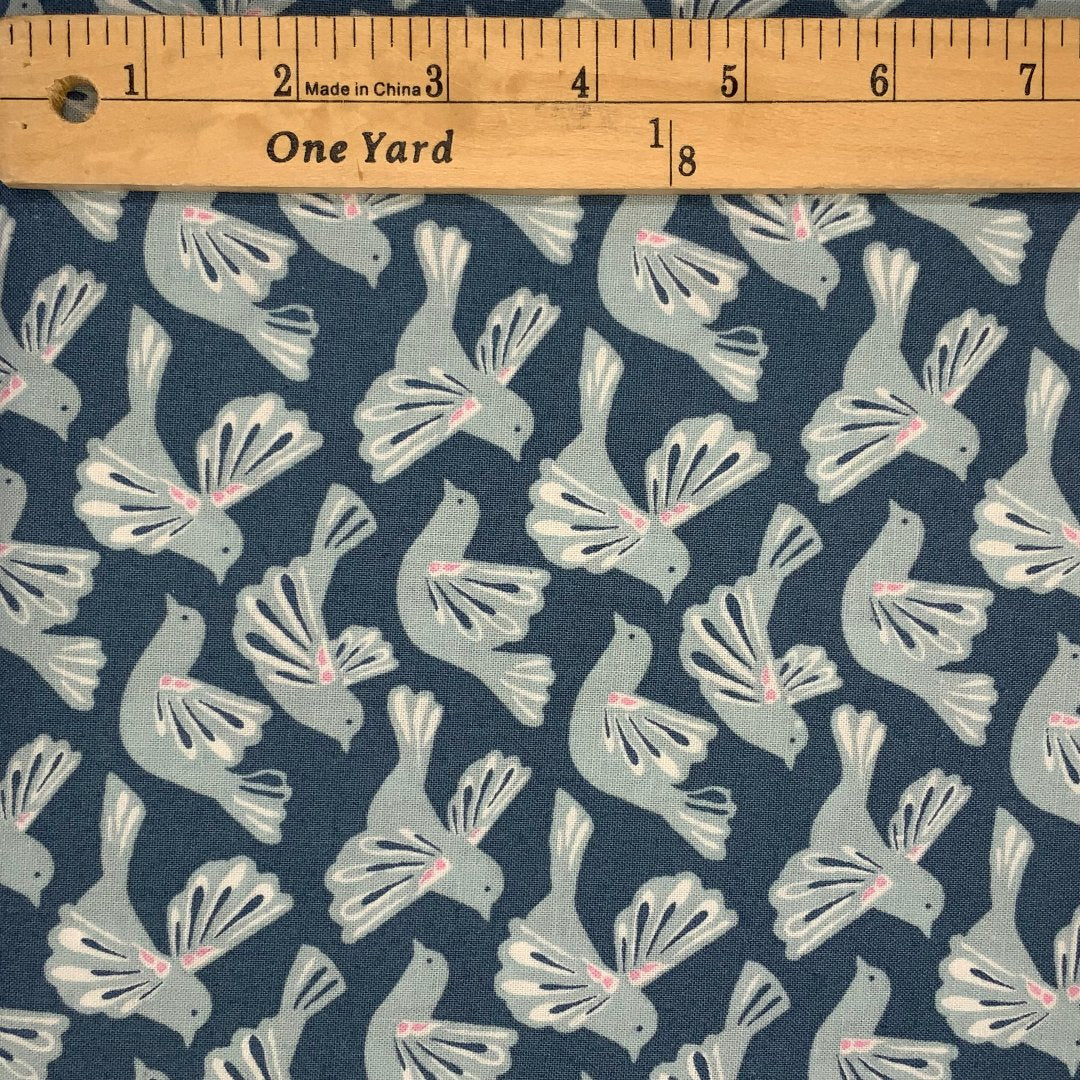 A bird design in shades of blue, white and pink.