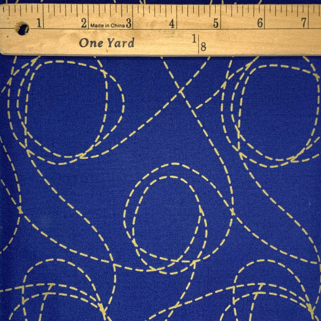 A random dashed lines design in shades of blue and metallic gold.