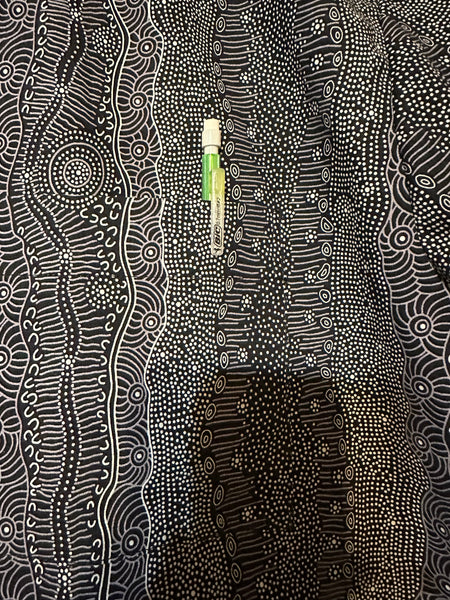Closeup of perfectly matched black and white pocket detail on handmade men's shirt