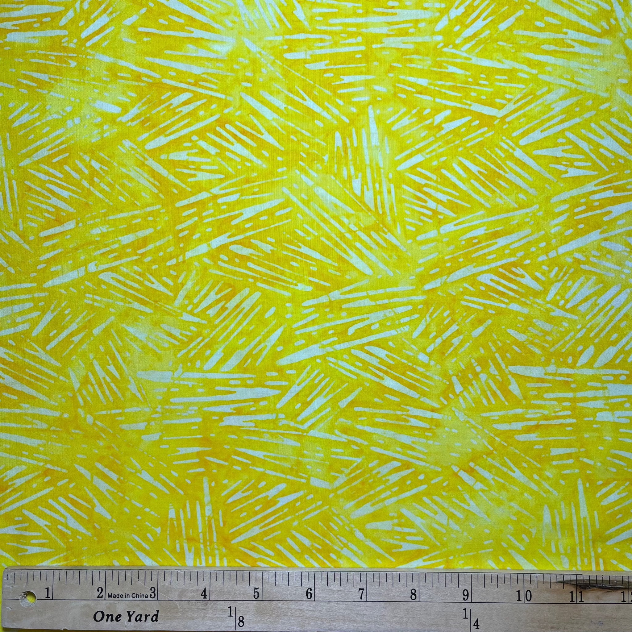 Velocity - Lemon is an abstract design in very light yellow/creamy white on a slightly darker slightly orangey yellow background.