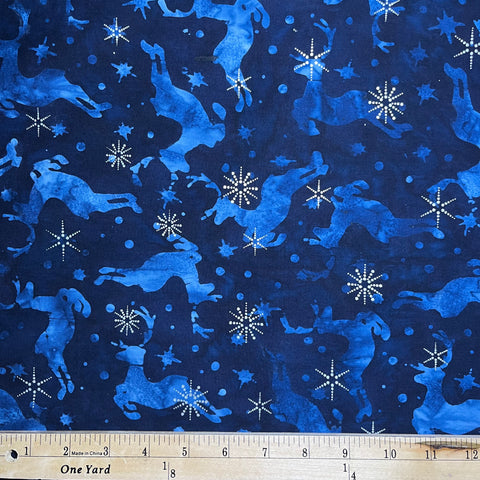 Winter Wonderland -Navy&nbsp; is a fun winter design: medium blue jumping reindeer and stars on a navy blue background with sparkly stars in metallic silver