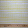 Happy go Lucky is a great neutral fabric featuring tiny yellow checkmarks and x's on a white background. 