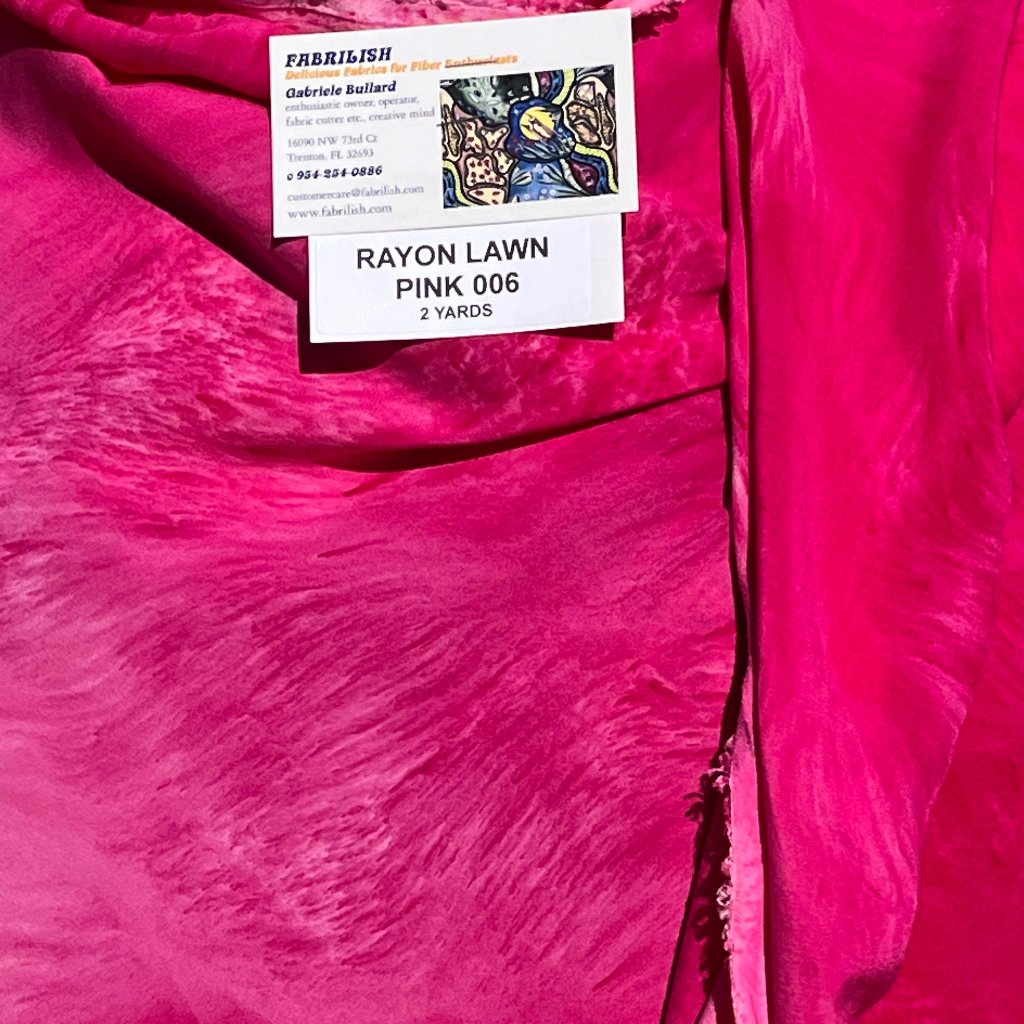 A SPLADDER DYED PINK PIECE OF FABRIC