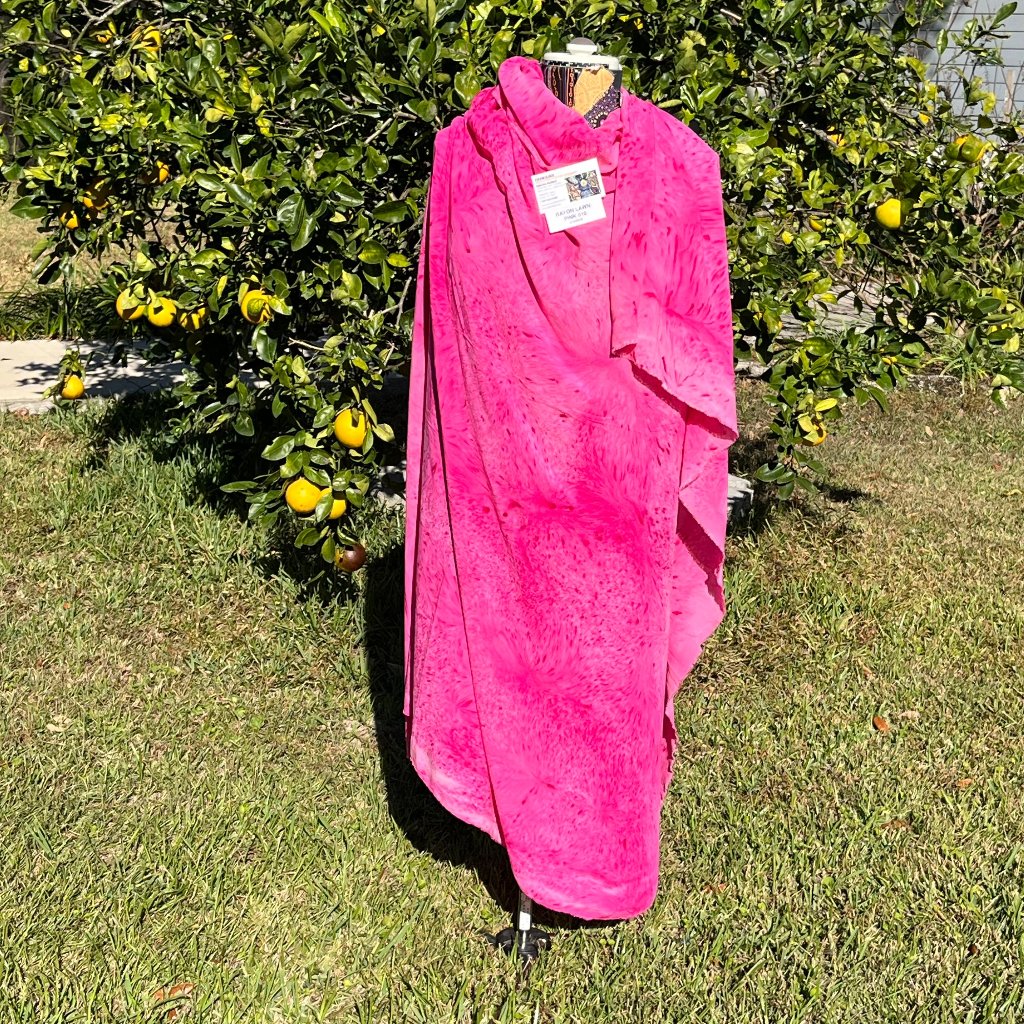 A SPLATTER DYED PINK PIECE OF FABRIC