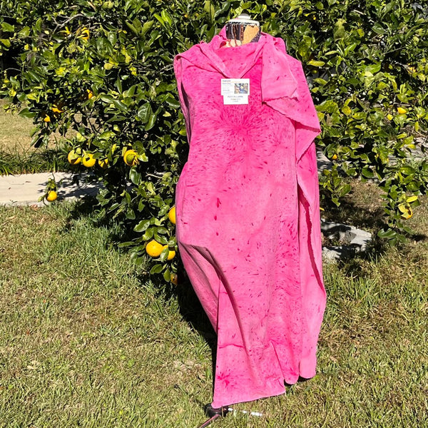 A SPLATTER DYED PINK PIECE OF FABRIC