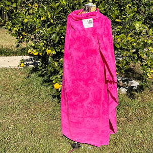 A SPLATTER DYED PINK PIECE OF FABRIC