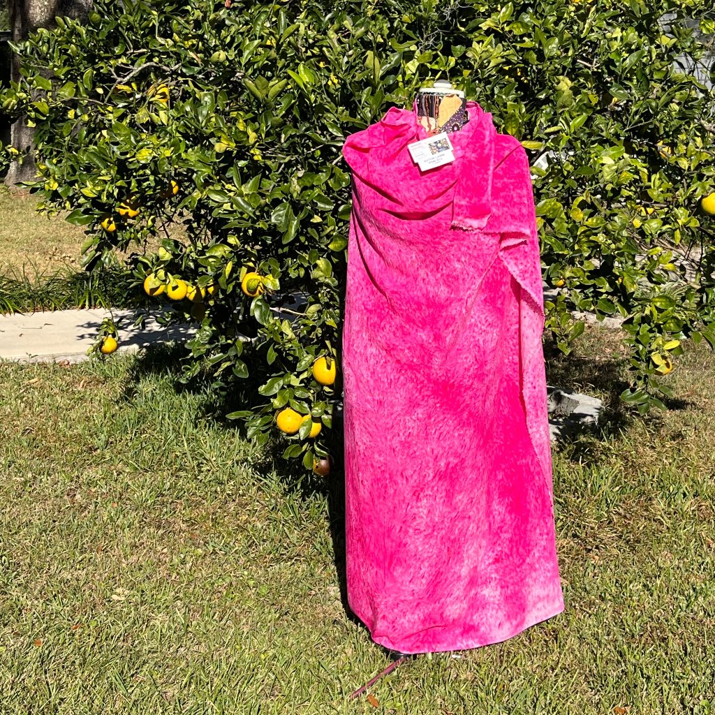 A SPLATTER DYED PINK PIECE OF FABRIC