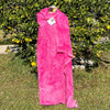 A SPLATTER DYED PINK PIECE OF FABRIC